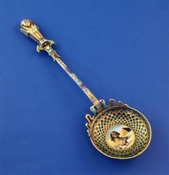 An early 20th century Egyptian 900 standard silver and plique a jour enamel spoon, 6in.